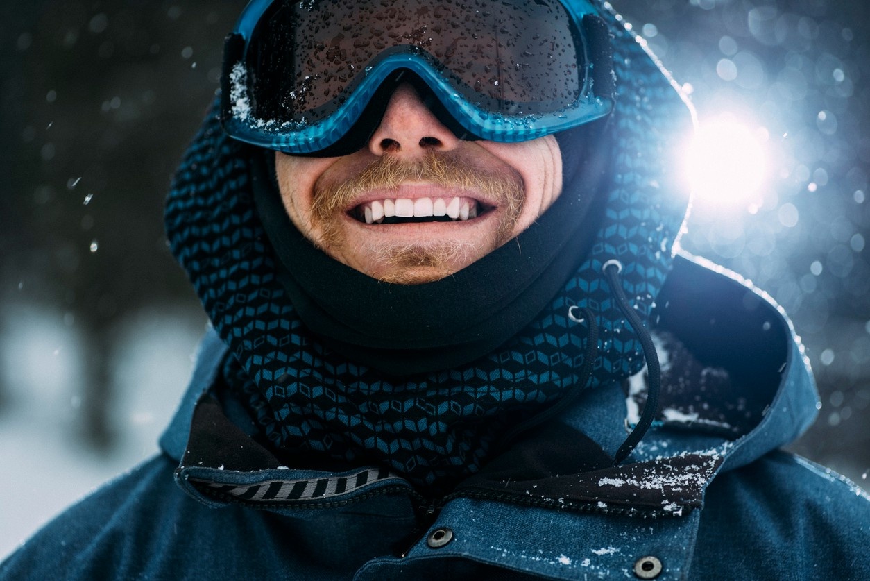 Man wearing blue ski goggles