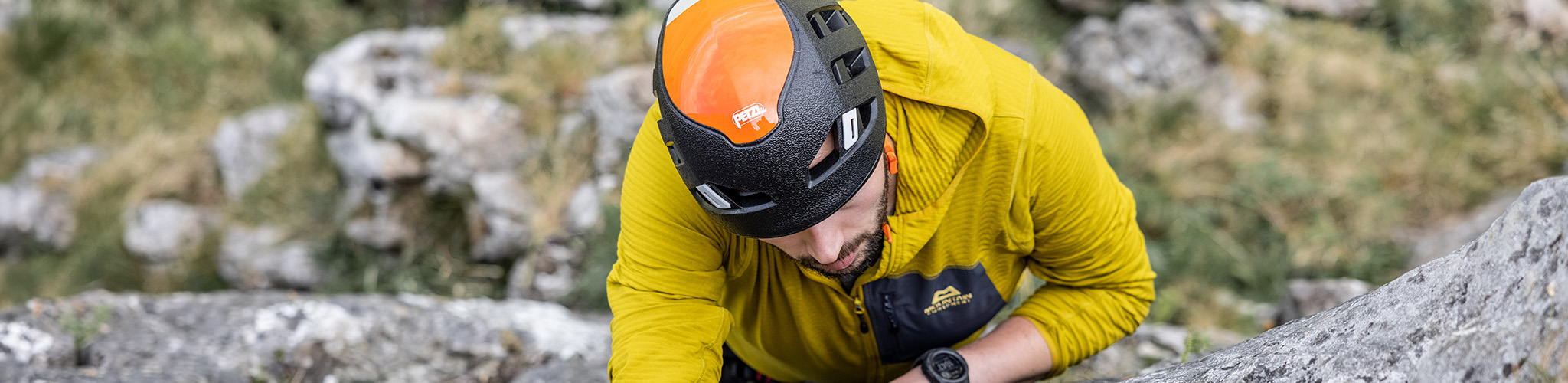 Shop climbing. A man climbing a rock