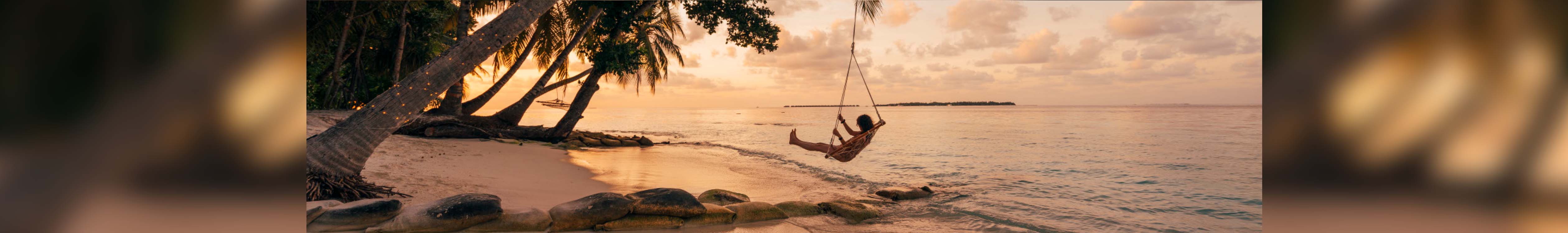 Travel. A pearson in a swing above sandy beach