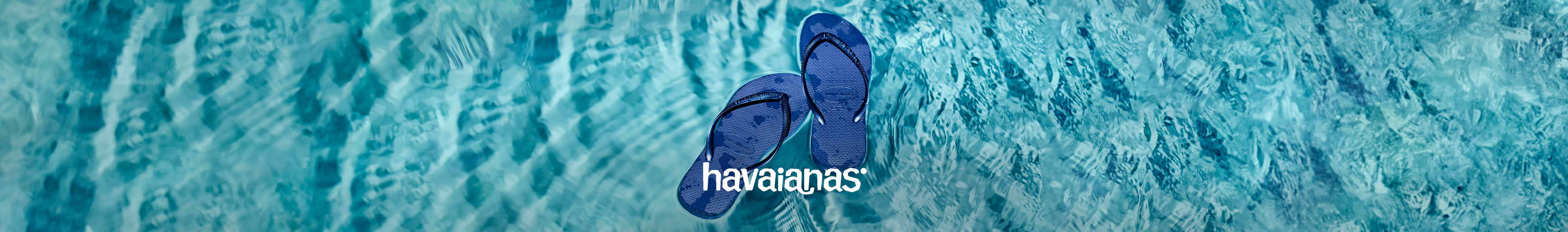 Two brue Havaianas flip flops are in the water