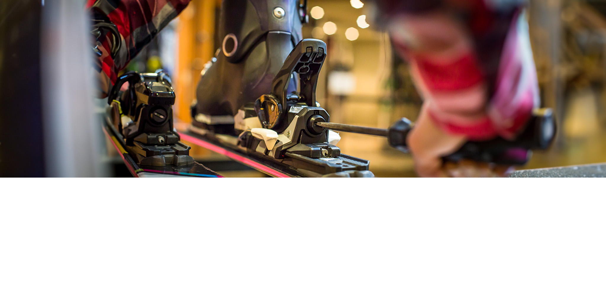 Footwear protection service - two people are standing next to a footwear protection machine in a shop