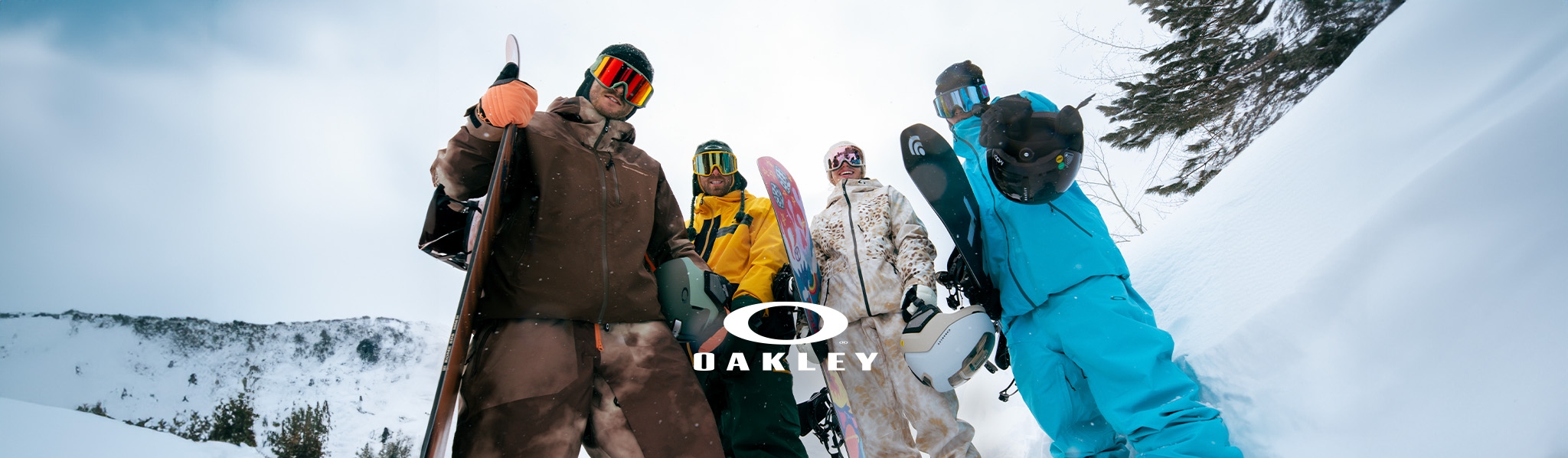 Snowboarders wearing Oakley Goggles