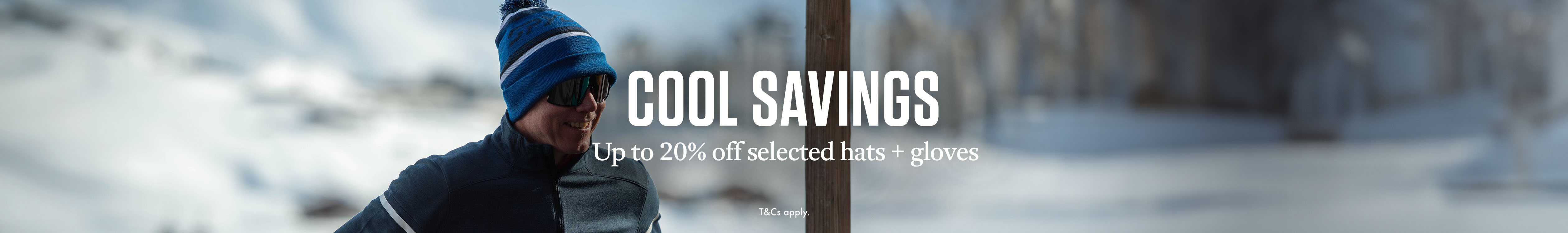 Cool savings of up to 20% off selected hats and gloves.  A man in a hat and dark glasses somewhere snowy