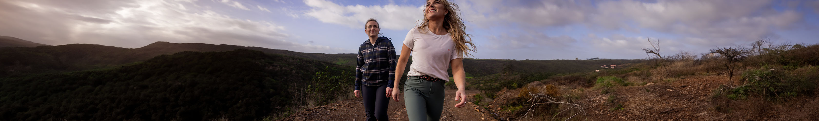 Legwear collection. Two hikers walking on a path