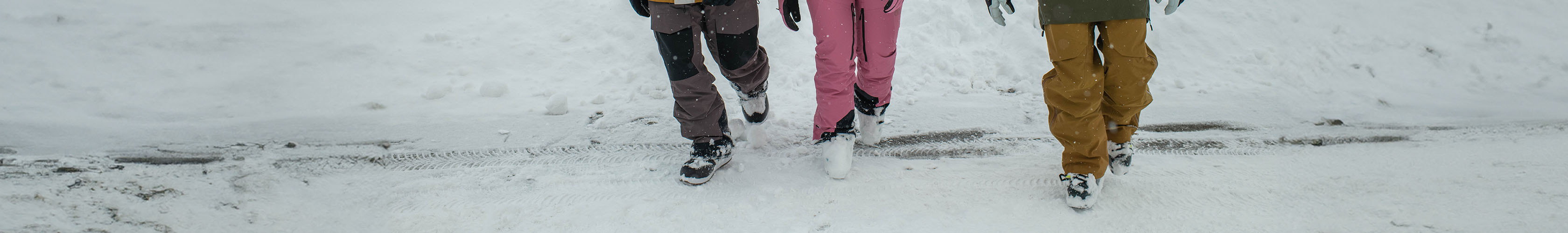 Shop Snowboard boots. People walking in the snow wearing snowboard boots. 