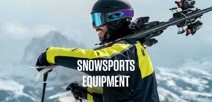 Shop Snowsport equipment new season. Man carrying skiies over his shoulder. 