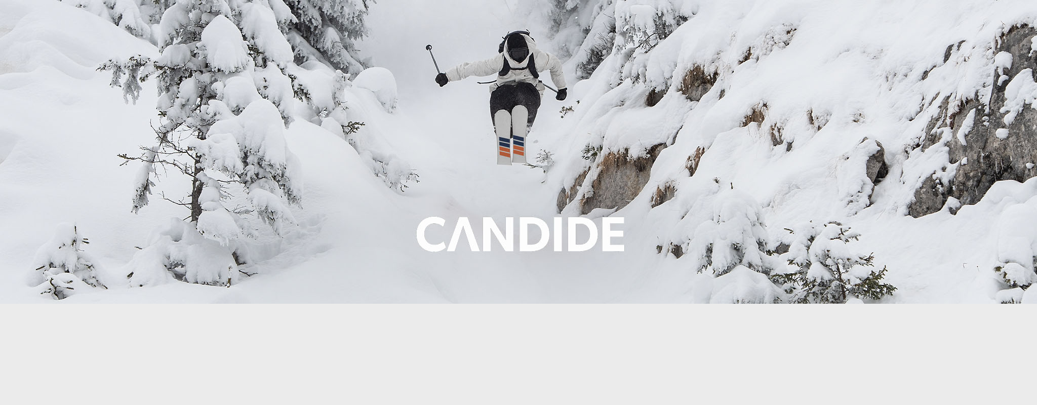 Shop Candide Skis. A person jumping, while skiing in Candide skis