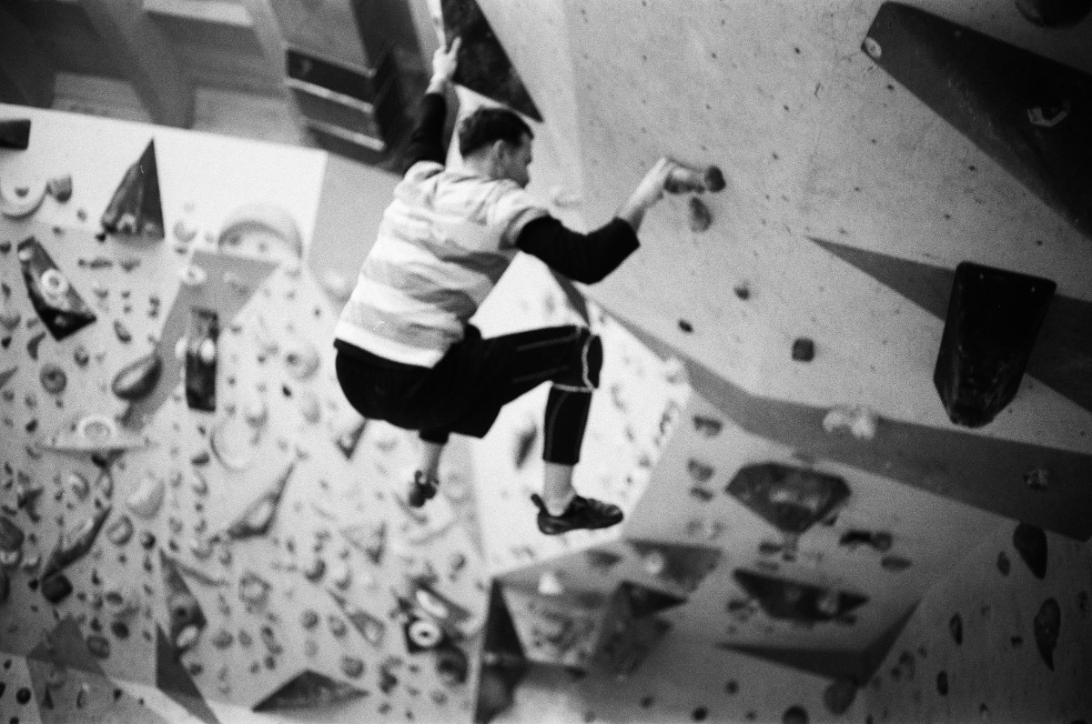 A person bouldering indoors