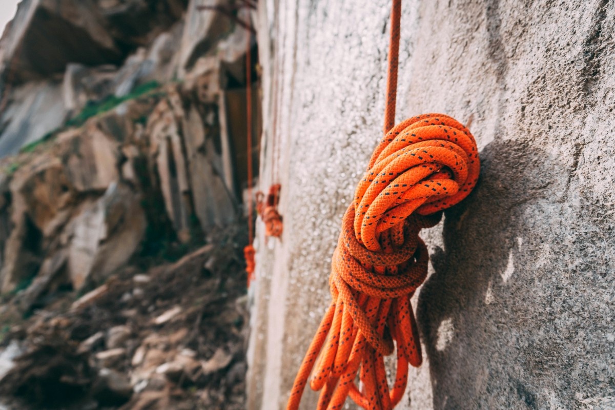 Climbing rope hanging off the crag 