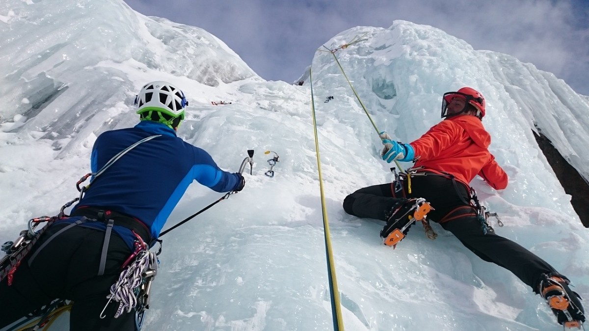 Two people ice climbing