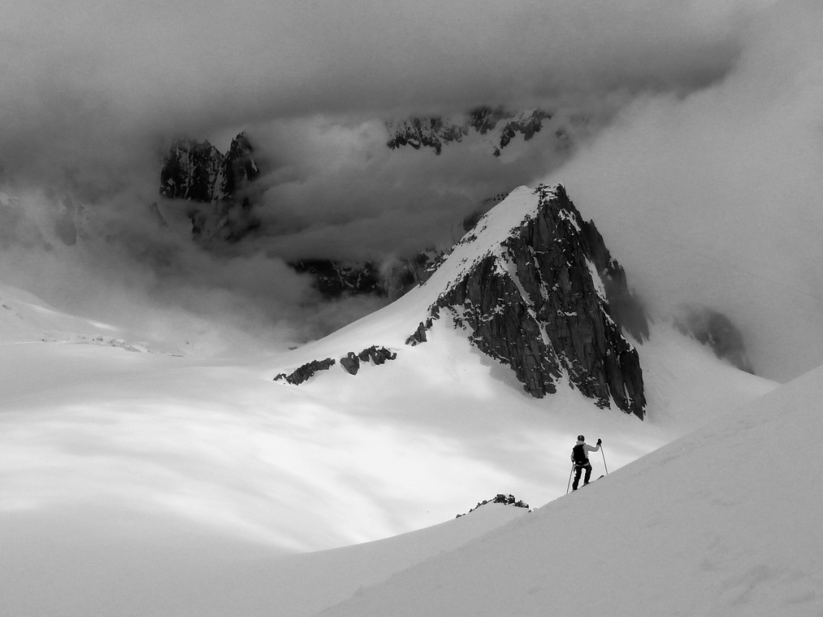 A person mountaineering on a snowy mountain