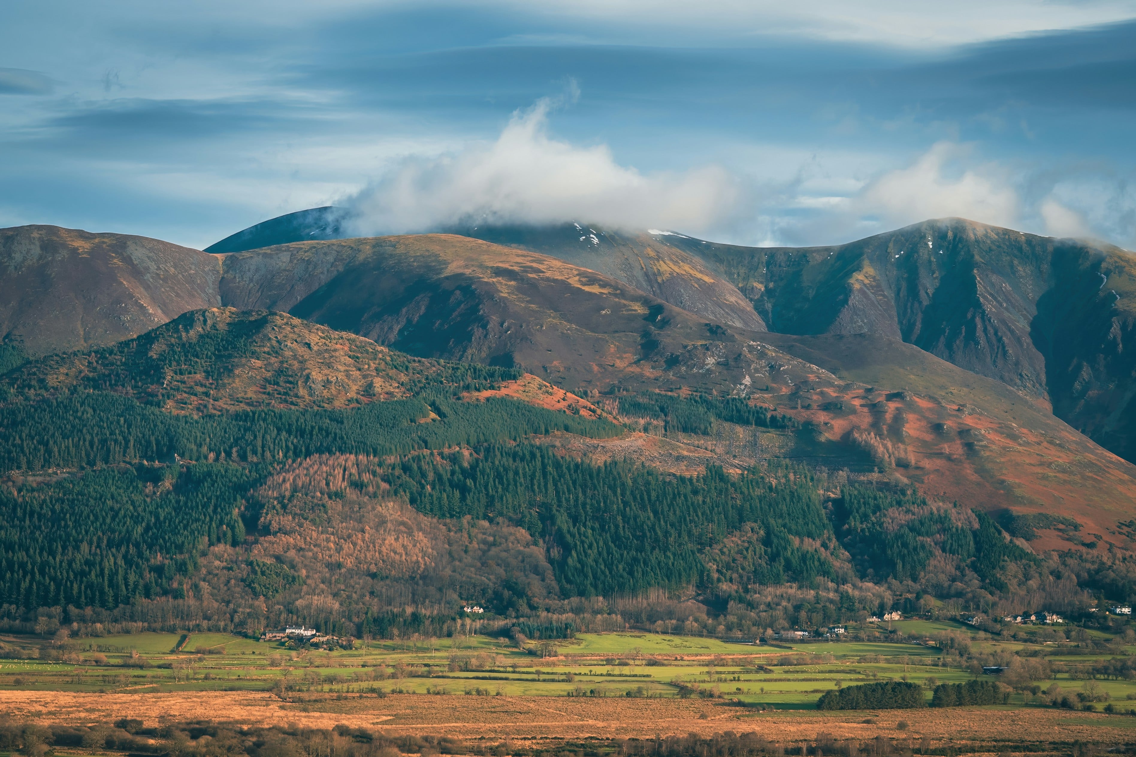 An image of Skiddaw with a cloud coming over 