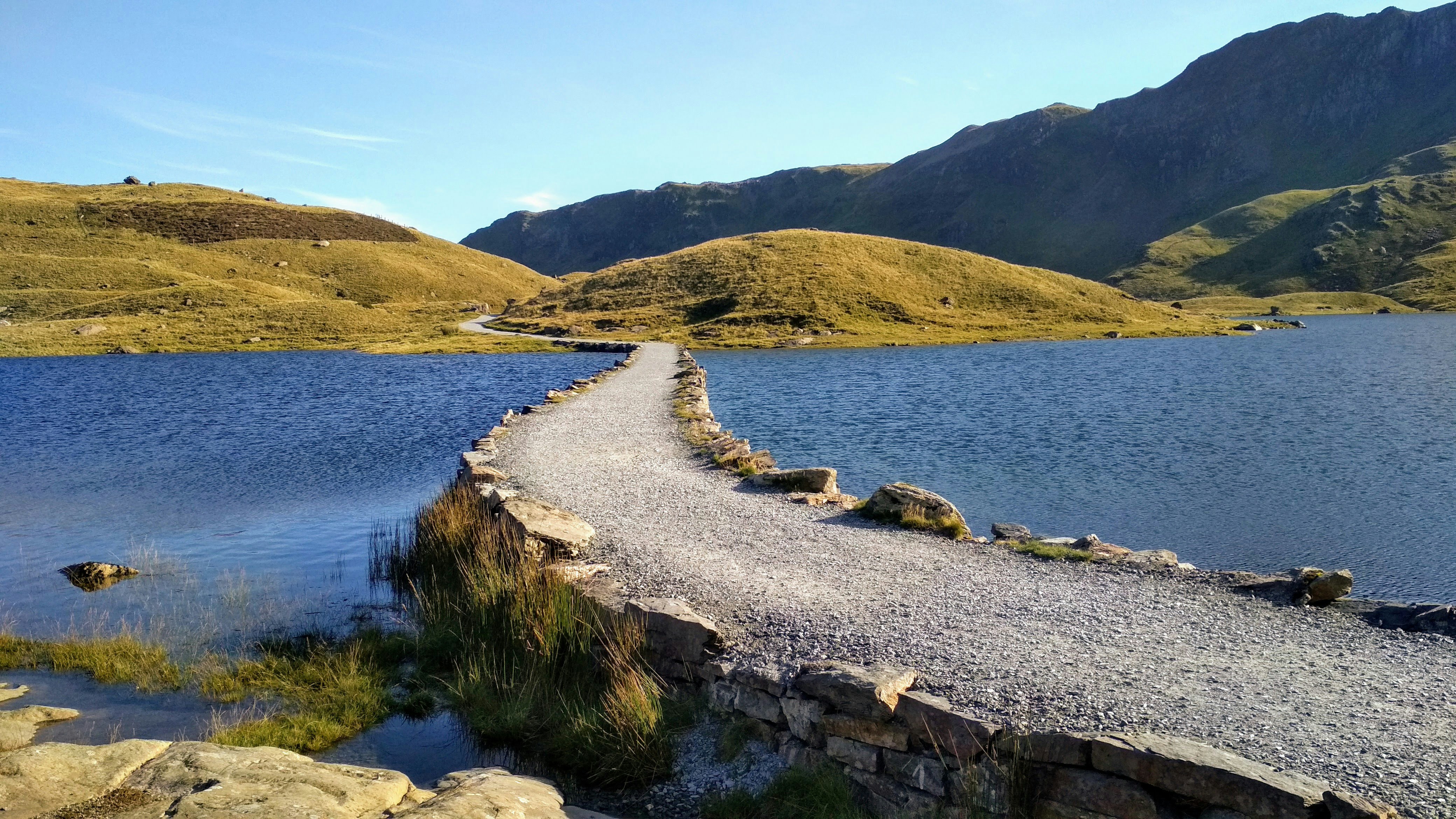 An image of a path over a lake in Snowdonia 