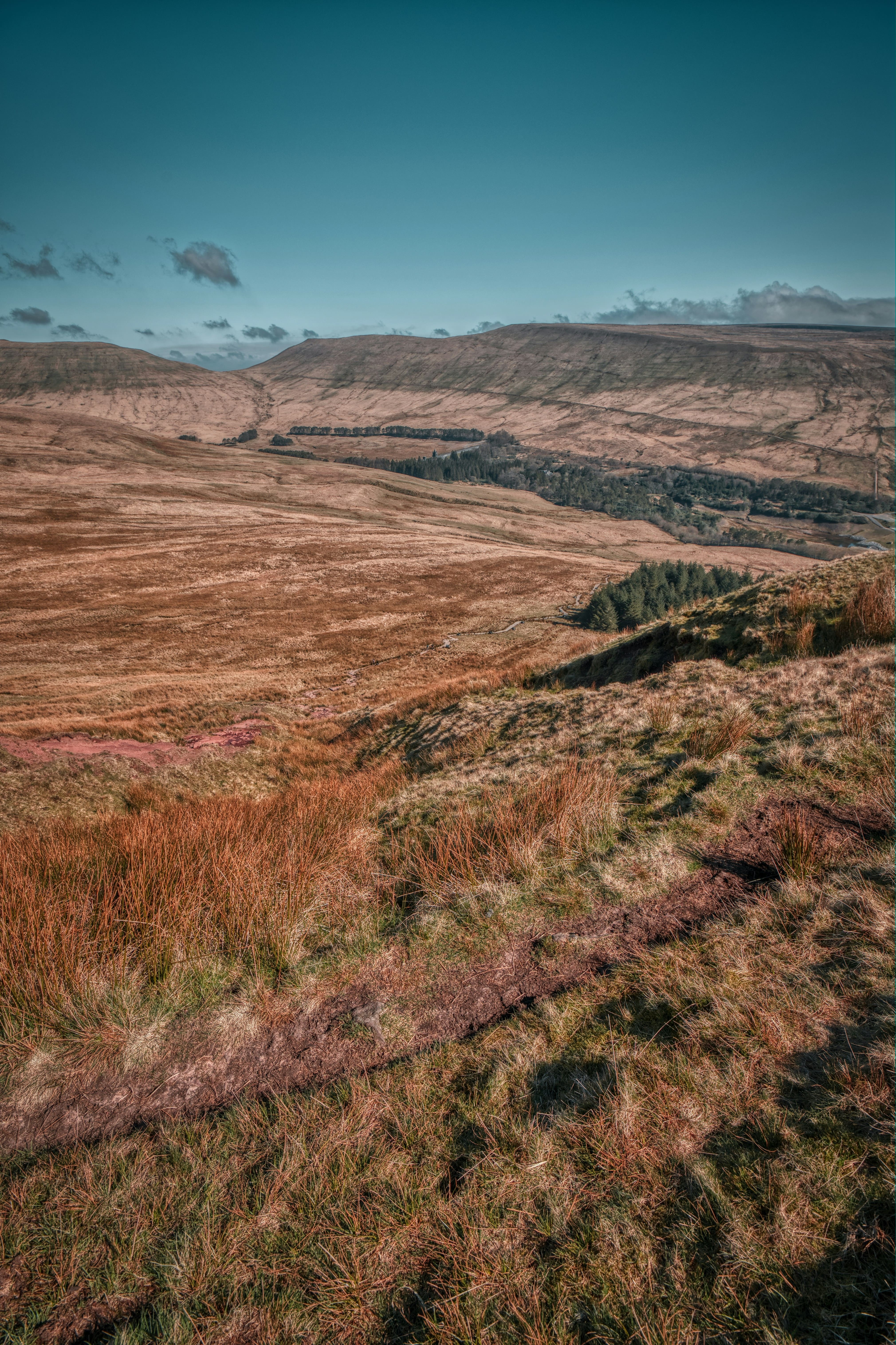 An image taken from the top of Pen Y Fan of the surrounding fields and hills