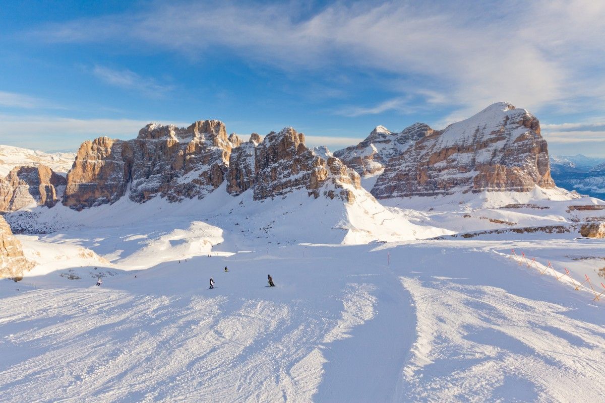 People skiing on the snowy piste of Cortina d'Ampezzo ski resort