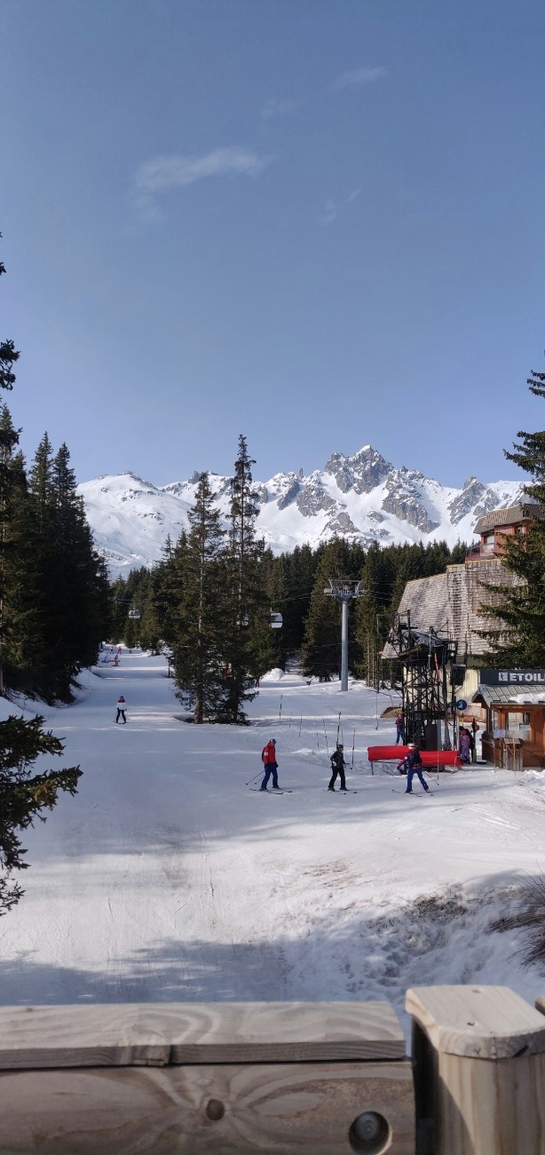 People walking with their snowsports gear at Courchevel ski resort