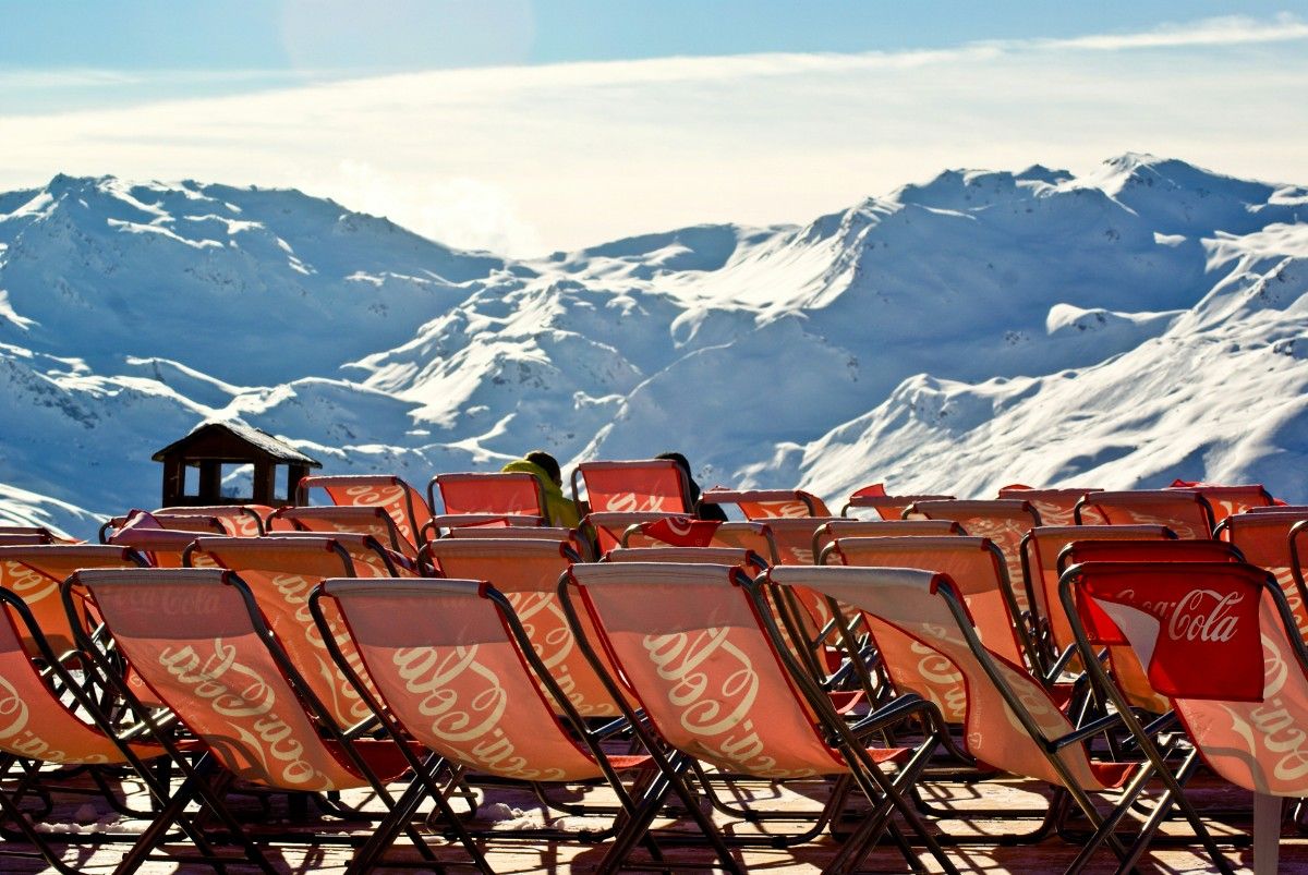 Coca cola branded chairs lined up at a viewing point at Courchevel ski resort