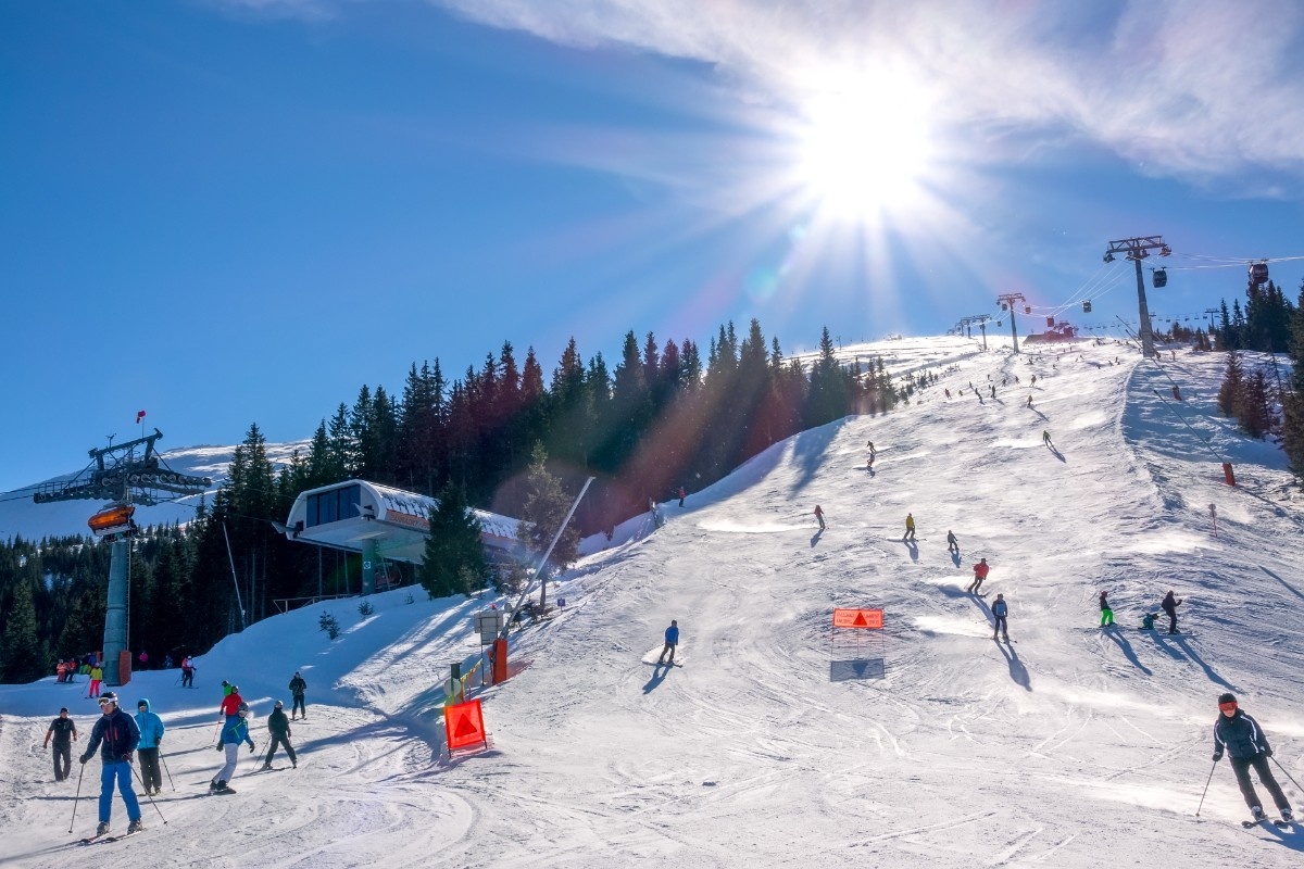 People skiing on the piste at Jasna Ski Resort