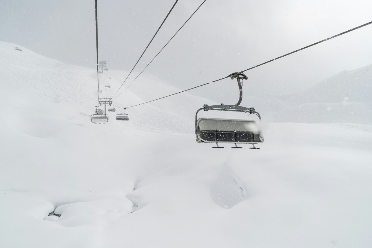 A chair lift in the snow landscape of Les Menuires ski resort