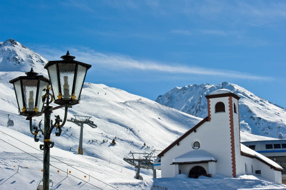 The church and a streetlamp in Obergurgl ski resort 