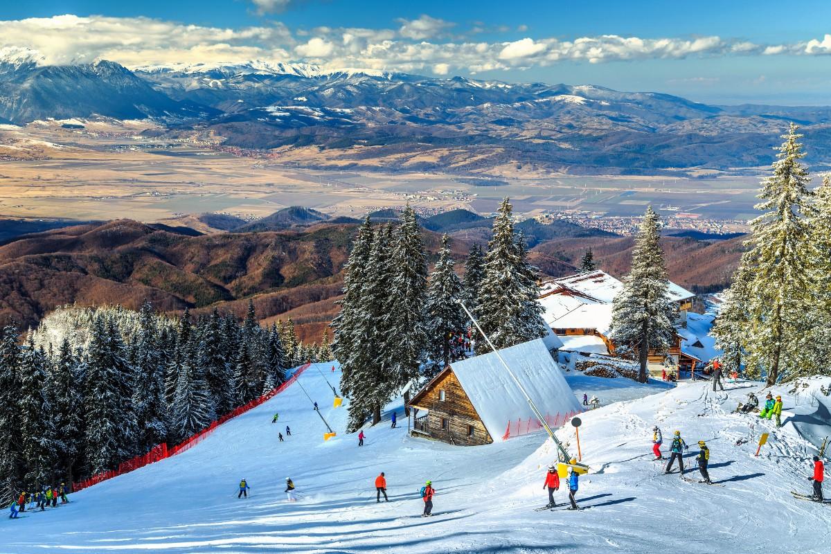 People on the piste at Poaina Brasov ski resort