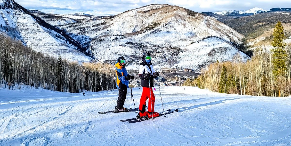 Two skiers on the piste at Vail Ski resort 