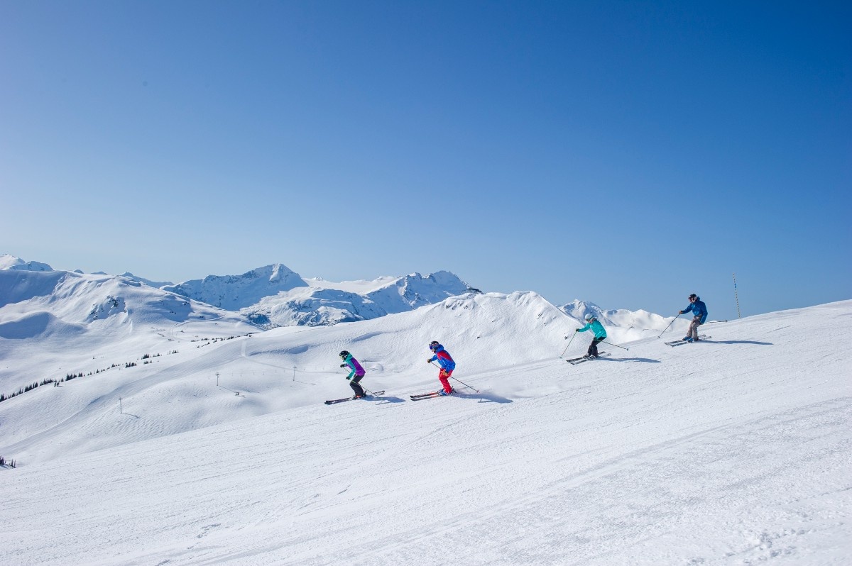 A group of friends skiing at Whistler Ski Resort, British Columbia