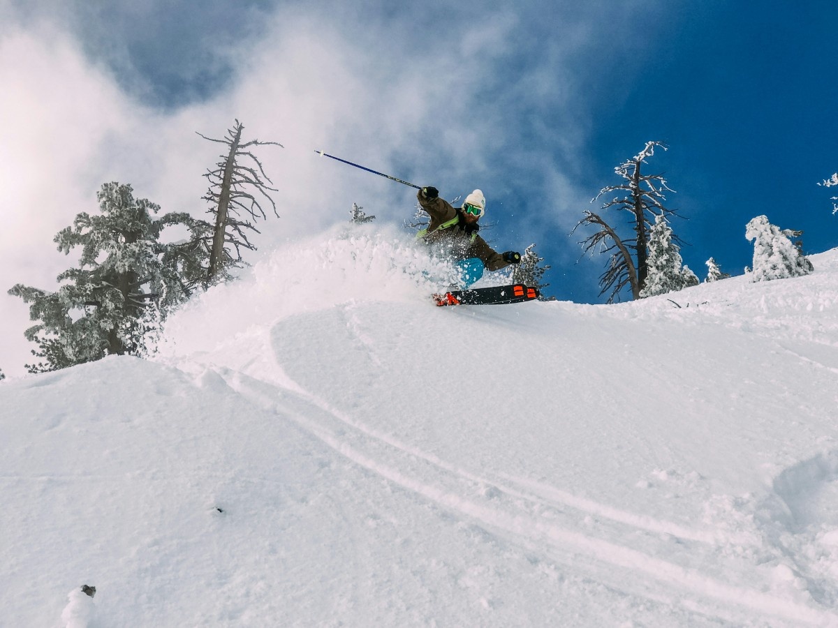 A person skiing off piste 