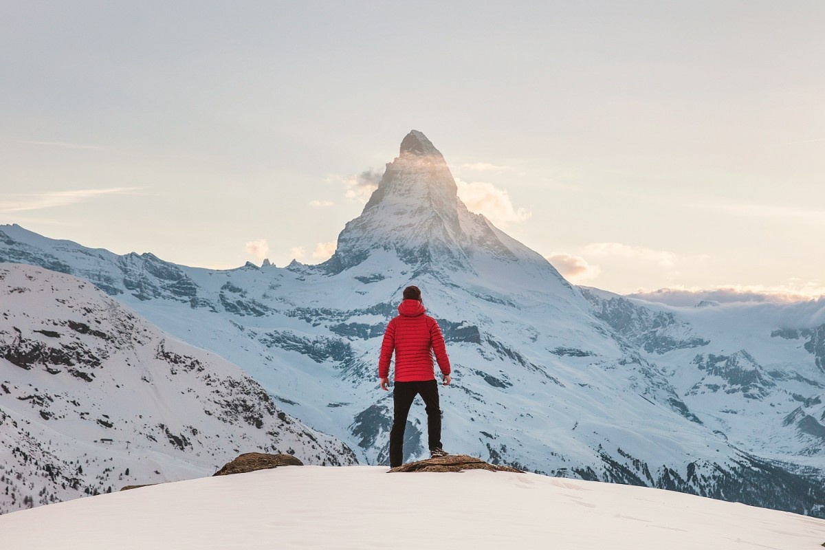 A man stood looking up at the Matterhorn in Zermatt 